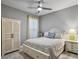 Bright bedroom with queen bed and built-in storage at 3002 Cross Vine Ln, Summerville, SC 29483