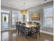 Spacious dining area with hardwood floors and large windows at 3002 Cross Vine Ln, Summerville, SC 29483