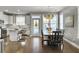 Bright dining room featuring a large wooden table and chandelier at 3002 Cross Vine Ln, Summerville, SC 29483