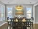 Elegant dining room with hardwood floors and a statement light fixture at 3002 Cross Vine Ln, Summerville, SC 29483