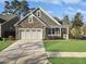 Charming craftsman home with stone accents and a 3-car garage at 3002 Cross Vine Ln, Summerville, SC 29483