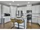 Modern kitchen featuring white cabinets, granite countertops, and stainless steel appliances at 3002 Cross Vine Ln, Summerville, SC 29483