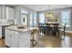 Open concept kitchen and dining area with hardwood floors at 3002 Cross Vine Ln, Summerville, SC 29483