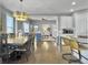 Open concept kitchen and living area with hardwood floors and stylish furnishings at 3002 Cross Vine Ln, Summerville, SC 29483