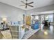 Spacious living room with hardwood floors, comfy seating, and an open floor plan at 3002 Cross Vine Ln, Summerville, SC 29483