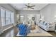 Open concept living room with hardwood floors, neutral decor, and natural light at 3002 Cross Vine Ln, Summerville, SC 29483