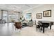 Elegant community lobby with comfortable seating, piano, and large windows at 3002 Cross Vine Ln, Summerville, SC 29483
