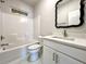 Bathroom with white vanity, quartz countertop, and black framed mirror at 3012 Harvey Ave, North Charleston, SC 29405