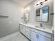 Double vanity bathroom with white cabinets and quartz countertops at 3012 Harvey Ave, North Charleston, SC 29405