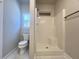 Clean bathroom with a large shower, toilet, and a window for natural light at 3012 Harvey Ave, North Charleston, SC 29405