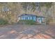 A blue house nestled in a wooded area with a spacious yard at 3041 Nye View Cir, Mount Pleasant, SC 29466