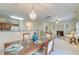 Open dining room with a chandelier and view into the living room at 3312 Middlesboro Ave, Summerville, SC 29485