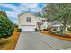 Two-story house with attached garage and manicured landscaping at 3312 Middlesboro Ave, Summerville, SC 29485