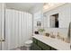 Clean bathroom with a green vanity and a white shower curtain at 344 Slow Mill Dr, Goose Creek, SC 29445