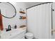 Simple bathroom with white vanity, black mirror, and white shower curtain at 344 Slow Mill Dr, Goose Creek, SC 29445