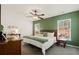 Spacious primary bedroom with green accent wall and ample natural light at 344 Slow Mill Dr, Goose Creek, SC 29445