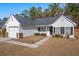 Charming one-story house with a gray roof, brick accents, and well-maintained landscaping at 344 Slow Mill Dr, Goose Creek, SC 29445