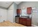 Kitchen features ample counter space, dark wood cabinets, and a laundry closet at 344 Slow Mill Dr, Goose Creek, SC 29445