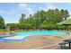 Community pool with lounge chairs and umbrellas at 344 Slow Mill Dr, Goose Creek, SC 29445