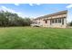Large grassy backyard with a view of the house at 3687 Hilton Dr, Johns Island, SC 29455