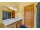 Simple bathroom with light wood cabinets and a single sink at 3687 Hilton Dr, Johns Island, SC 29455