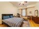 Comfortable bedroom with hardwood floors and a built-in dresser at 3687 Hilton Dr, Johns Island, SC 29455