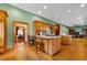 Kitchen with island and wooden cabinets, opens to living area at 3687 Hilton Dr, Johns Island, SC 29455