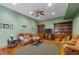 Relaxing living room with hardwood floors, comfortable seating, and built-in shelving at 3687 Hilton Dr, Johns Island, SC 29455