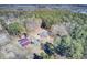 Aerial view of house and barn in wooded area at 369 Groomsville Rd, Moncks Corner, SC 29461