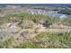 Aerial view of property showing house and surrounding wooded area at 369 Groomsville Rd, Moncks Corner, SC 29461