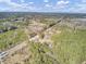 Aerial view of property showing house and surrounding forest at 369 Groomsville Rd, Moncks Corner, SC 29461
