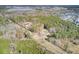 Aerial view of property with two houses and surrounding trees at 369 Groomsville Rd, Moncks Corner, SC 29461