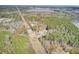 Aerial view of property with house and surrounding forest at 369 Groomsville Rd, Moncks Corner, SC 29461