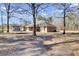 Large backyard with trees and trampoline at 369 Groomsville Rd, Moncks Corner, SC 29461