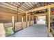 Barn interior with wooden stalls and storage at 369 Groomsville Rd, Moncks Corner, SC 29461