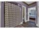Bathroom with shower stall, toilet, and patterned shower curtain at 369 Groomsville Rd, Moncks Corner, SC 29461