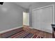 Bedroom with closet and striped rug at 369 Groomsville Rd, Moncks Corner, SC 29461