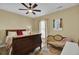 Bedroom with sleigh bed, ceiling fan, and window with curtains at 369 Groomsville Rd, Moncks Corner, SC 29461