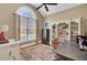 Home office with built-in shelving and large arched window at 369 Groomsville Rd, Moncks Corner, SC 29461