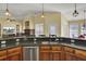 Island kitchen with granite countertops and stainless steel dishwasher at 369 Groomsville Rd, Moncks Corner, SC 29461