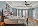 Main bedroom featuring a king-size bed and hardwood floors at 369 Groomsville Rd, Moncks Corner, SC 29461