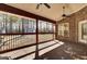 Screened porch with brick wall and view of backyard at 369 Groomsville Rd, Moncks Corner, SC 29461