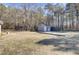 Gray storage shed in wooded backyard at 369 Groomsville Rd, Moncks Corner, SC 29461