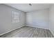 Empty bedroom with wood-look floors and window at 415 Parkdale Dr # 16-F, Charleston, SC 29414