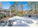 Snowy backyard with screened porch and patio furniture at 5099 Ballantine Dr, Summerville, SC 29485