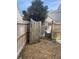 Wooden fence gate opens to a backyard with shed and small yard at 5099 Ballantine Dr, Summerville, SC 29485