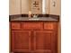 Dark vanity with granite countertop and sink at 5099 Ballantine Dr, Summerville, SC 29485