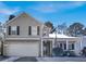 Two-story house with a garage and front porch, snow on the ground at 5099 Ballantine Dr, Summerville, SC 29485
