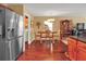 Kitchen features stainless steel refrigerator and hardwood floors at 5099 Ballantine Dr, Summerville, SC 29485