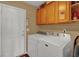 Clean laundry room with washer, dryer, and ample storage at 5099 Ballantine Dr, Summerville, SC 29485